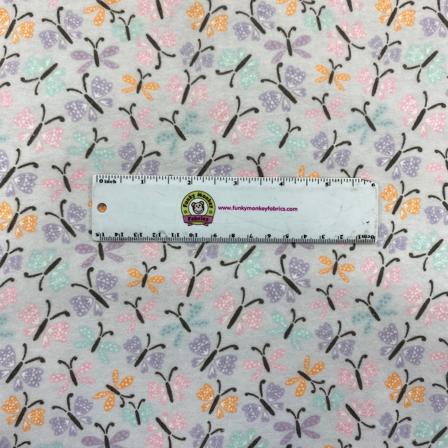 CLEARANCE Butterflies on Light Purple - Camelot Flannel