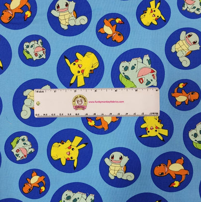  Pokemon in Circles on Blue - Robert Kaufman Cotton (17721-4)