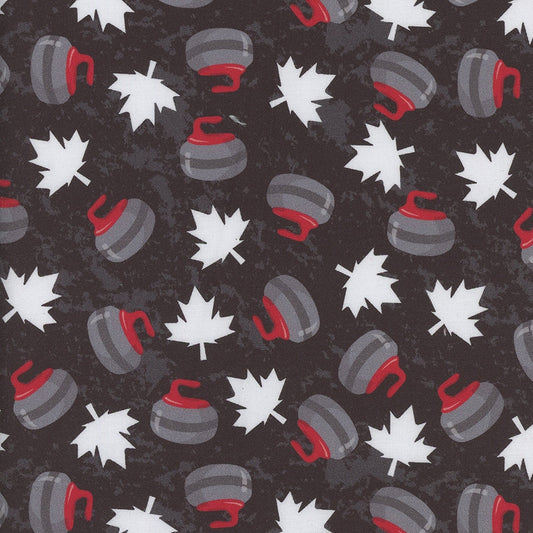 Fabric pattern with curling stones and leaves on a black background, measured by a ruler at the bottom.