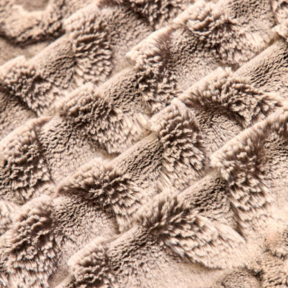 Close-up of textured beige fabric with a wavy pattern