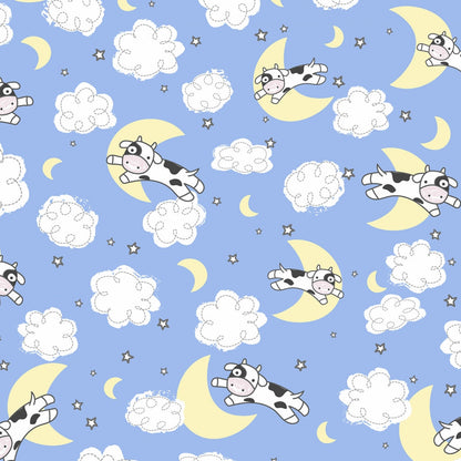 Pattern of cows on moons and clouds with a blue background
